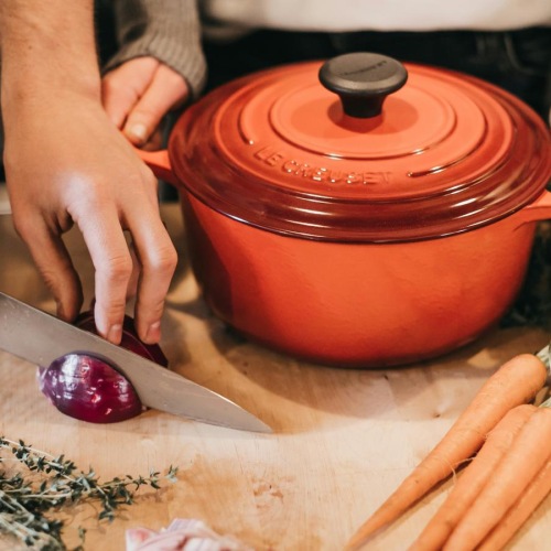 a person cutting vegetables