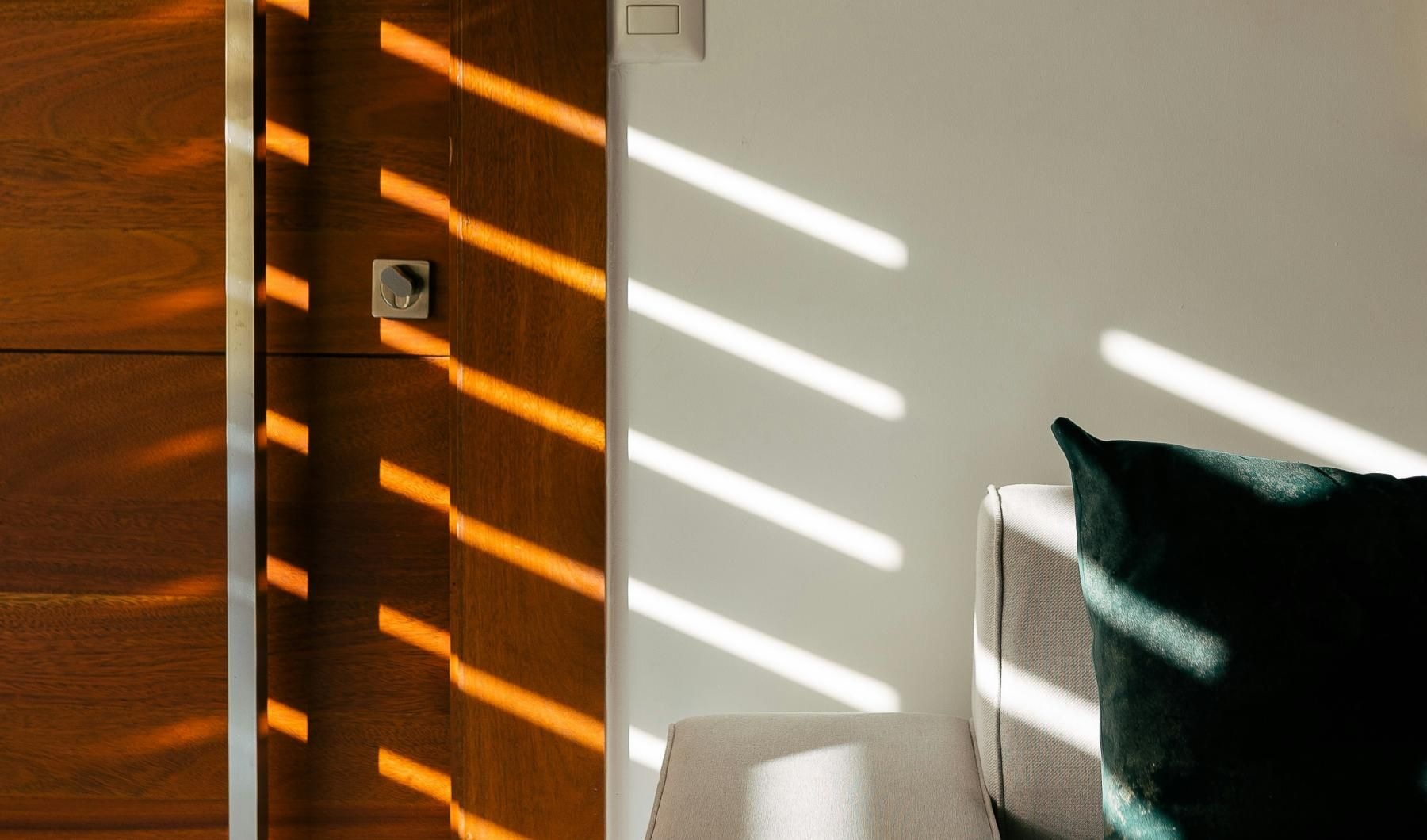 a chair next to a wall